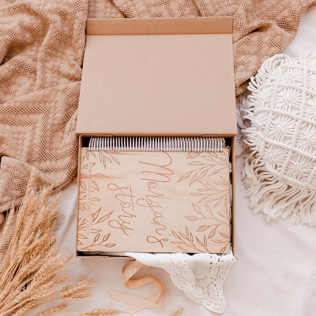 Top view of open Hello Fern custom kraft baby keepsake box showing how it fits our wooden personalised baby book inside.