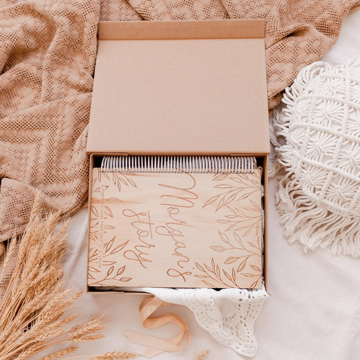Top view of open Hello Fern custom kraft baby keepsake box showing how it fits our wooden personalised baby book inside.