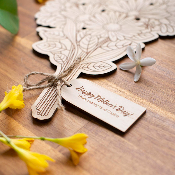 Closeup of custom wooden tag attached to Hello Fern Mother's Day wooden flower bouquet.