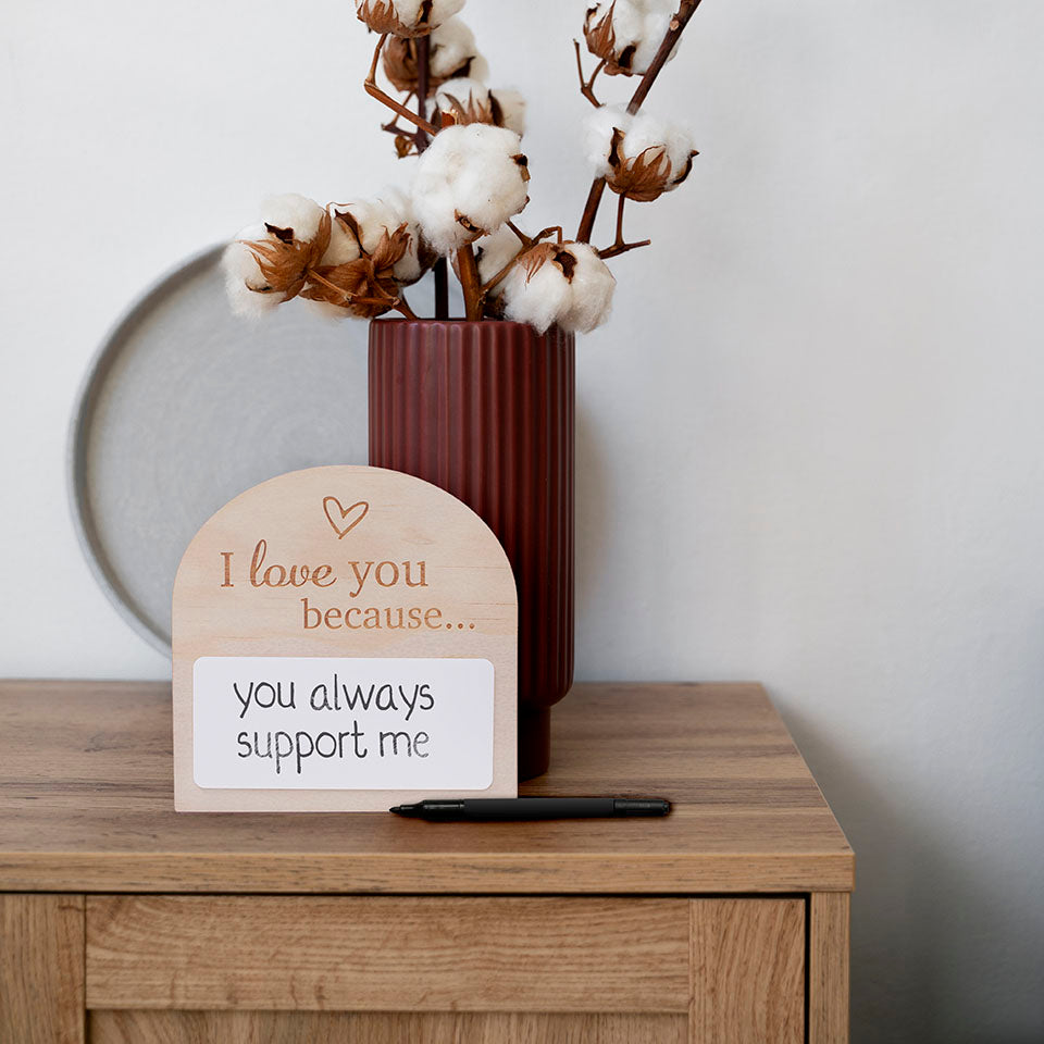 Hello Fern mini daily affirmation plaque - I love you because... sitting on wooden bench with minimal home decor and plant in vase.