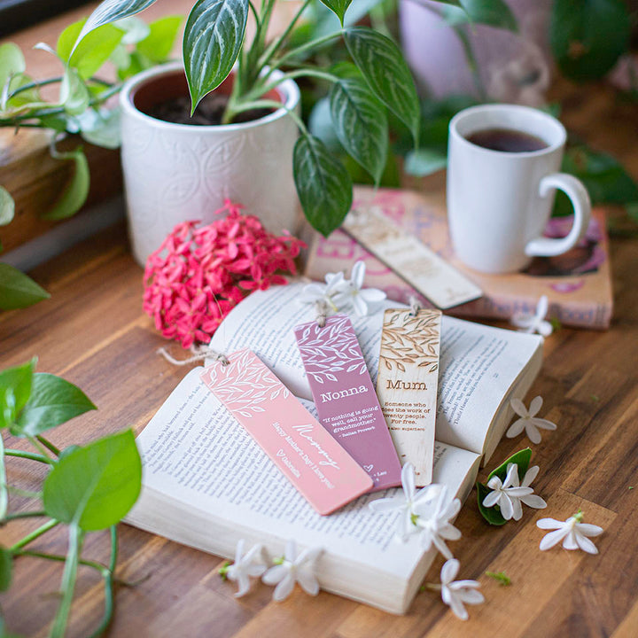 Hello Fern Mother's Day bookmarks on table with flowers books and tea.