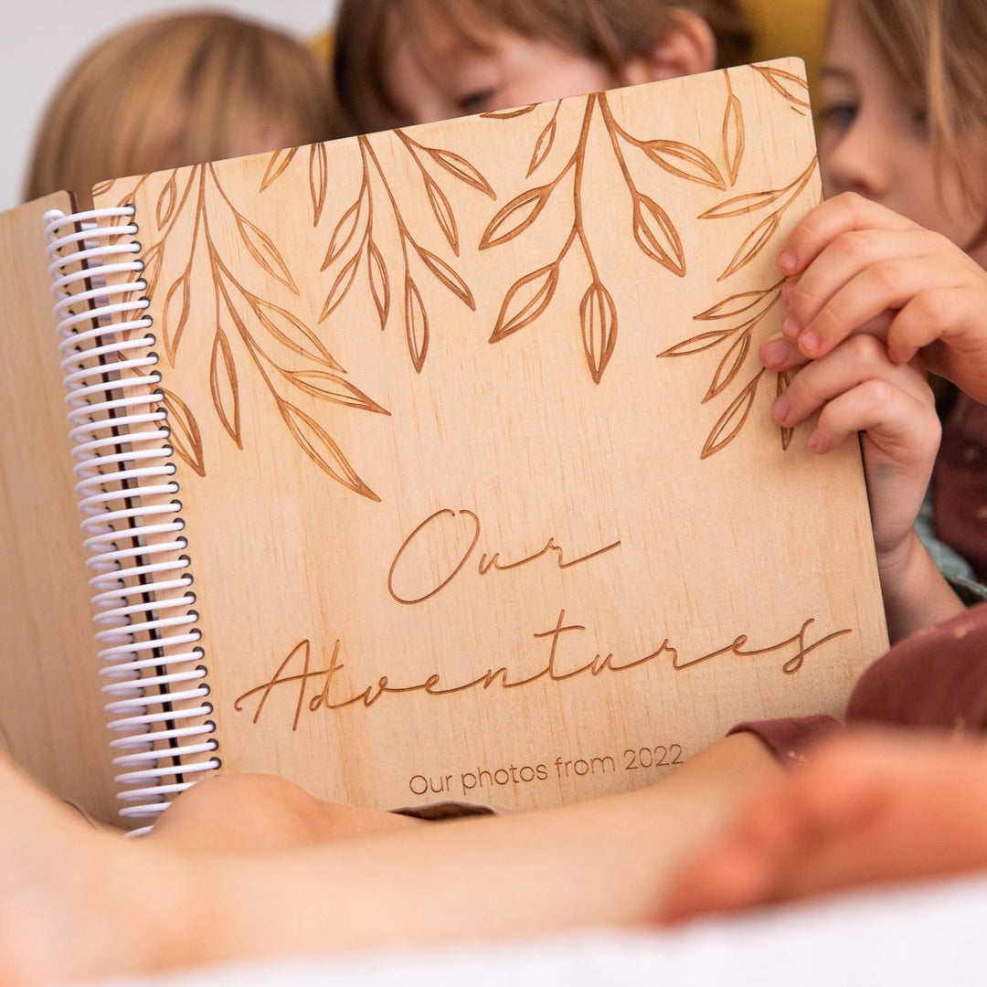 Closeup of Hello Fern wooden photo album cover.