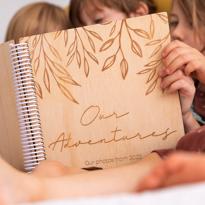 Closeup of Hello Fern wooden photo album cover.