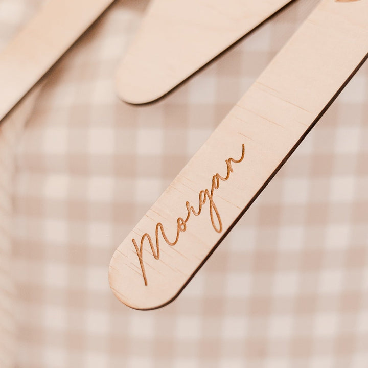 Closeup of brown Christmas Santa sac with wooden letter 'M' plaque and name 'Morgan' etched into plaque.