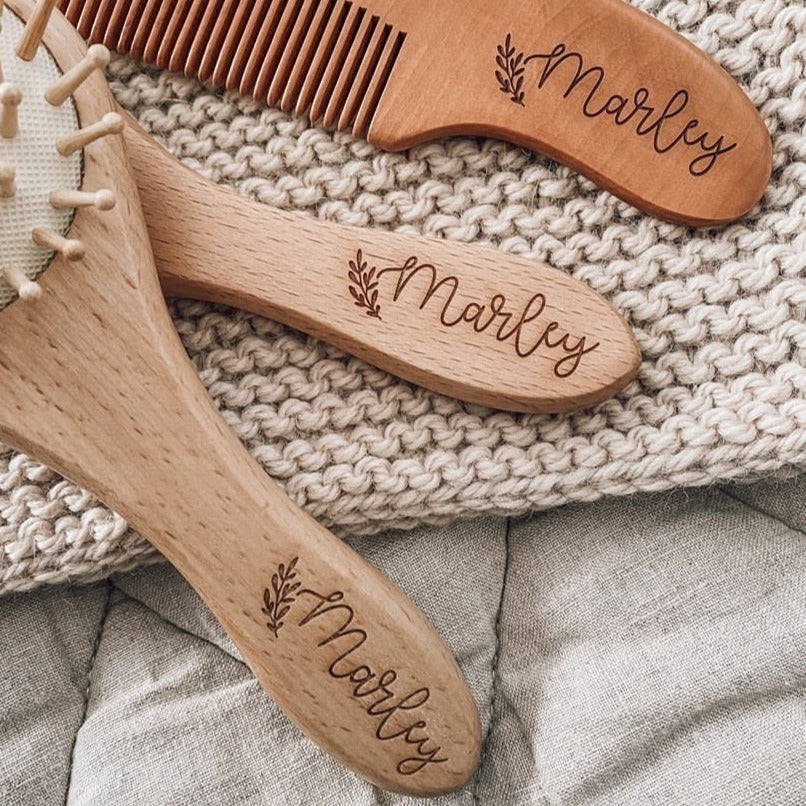 Closeup view of names etched on to the Hello Fern custom baby brush set using Font 2.