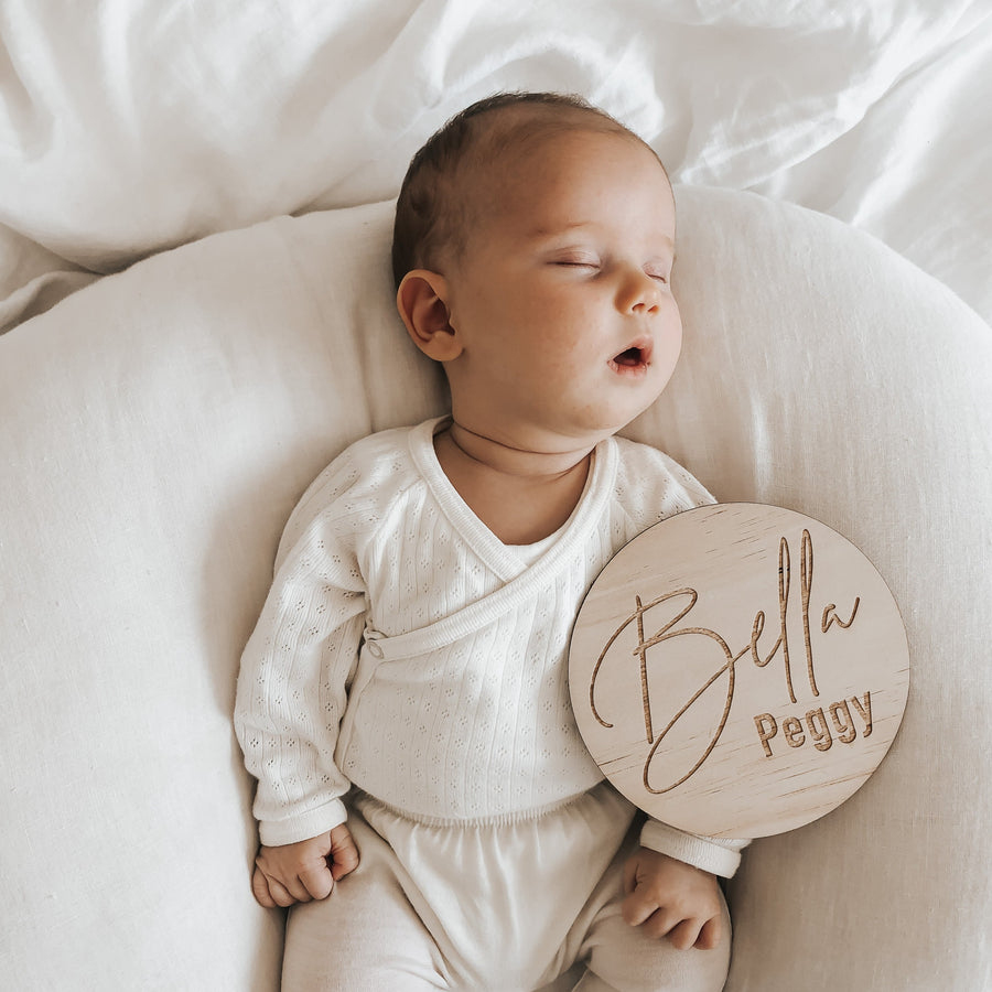 Sleeping baby with Hello Fern classic wooden name plaque customised with baby's name.