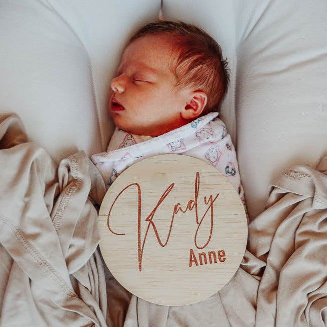 Sleeping newborn with Hello Fern classic wooden name plaque customised with baby's name.
