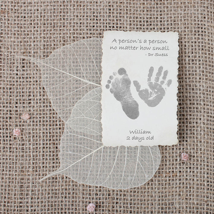 Child's hand and foot print on beautiful hand-made card with hessian background.
