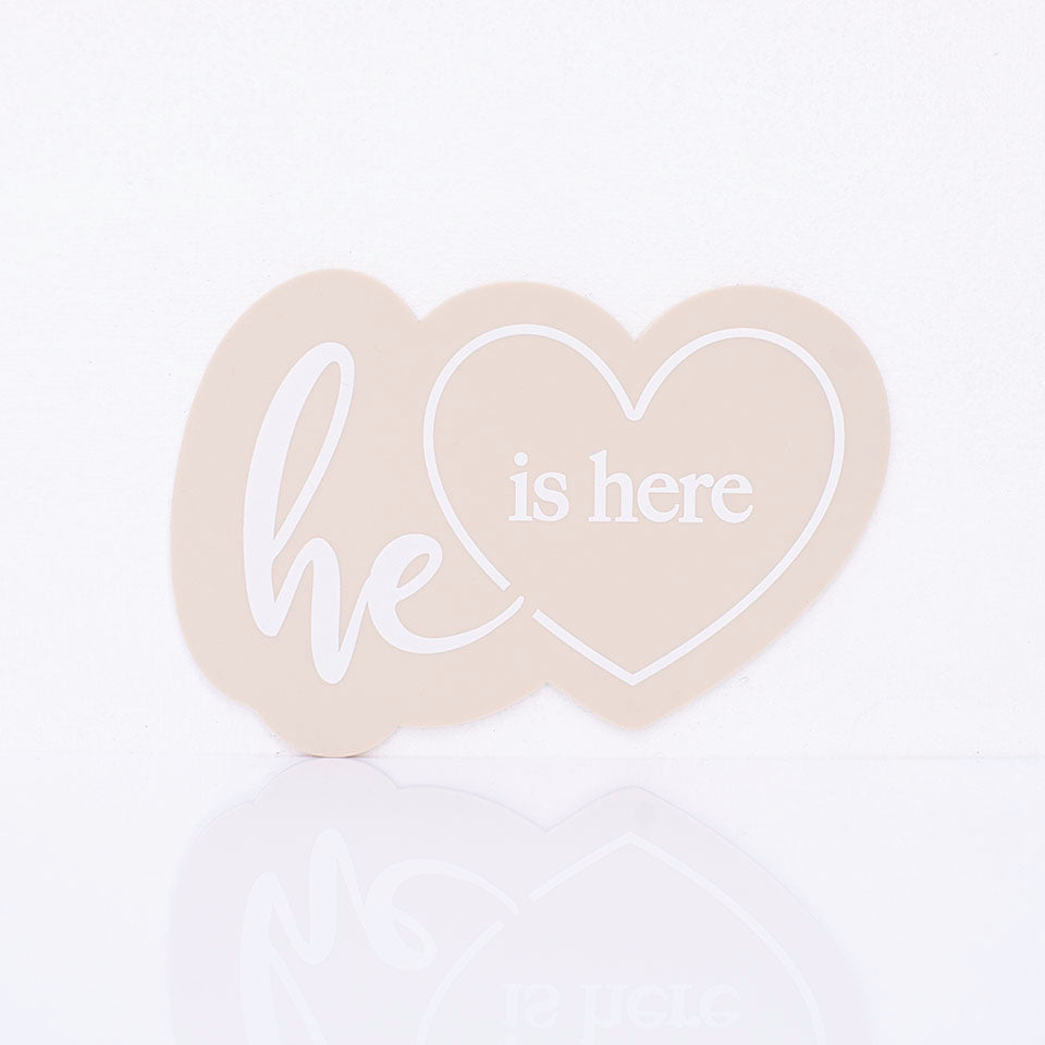 Hello Fern beige acrylic "he is here" birth announcement plaque in a goregous heart shape minimalist design.