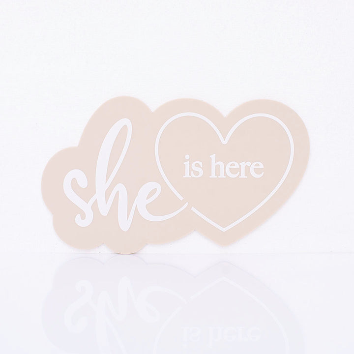 Hello Fern beige acrylic "she is here" birth announcement plaque in a goregous heart shape minimalist design.