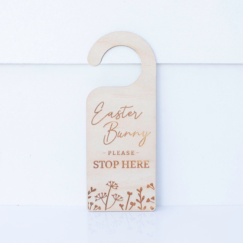 Hello Fern Easter Bunny please stop here wooden door hanger isolated on white background.