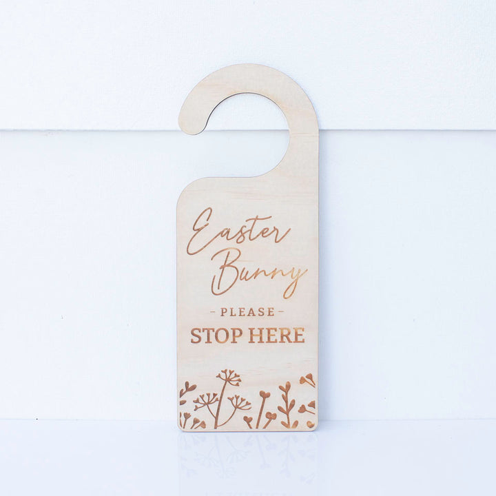 Hello Fern Easter Bunny please stop here wooden door hanger isolated on white background.