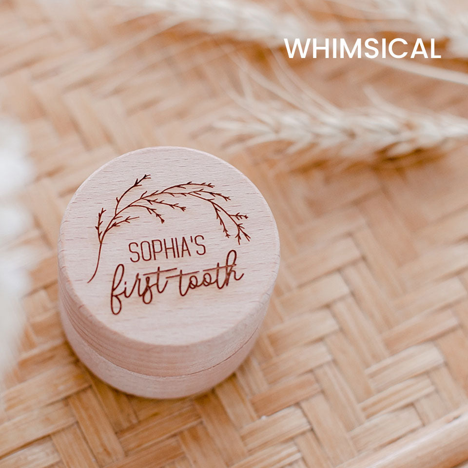 Closeup of Hello Fern baby's first tooth wooden trinket box in whimsical style, customised with child's name.