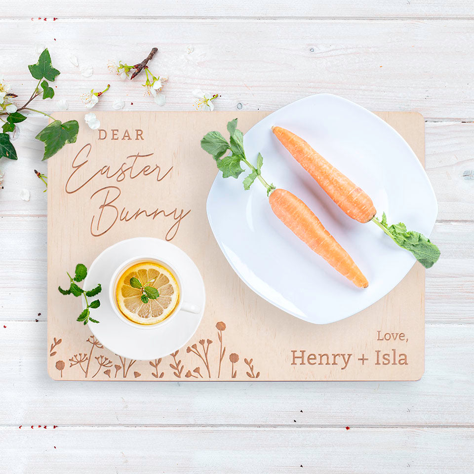 Hello Fern custom timber Easter Bunny snack board with wildflowers design shown on tabletop with carrots and lemon tea.