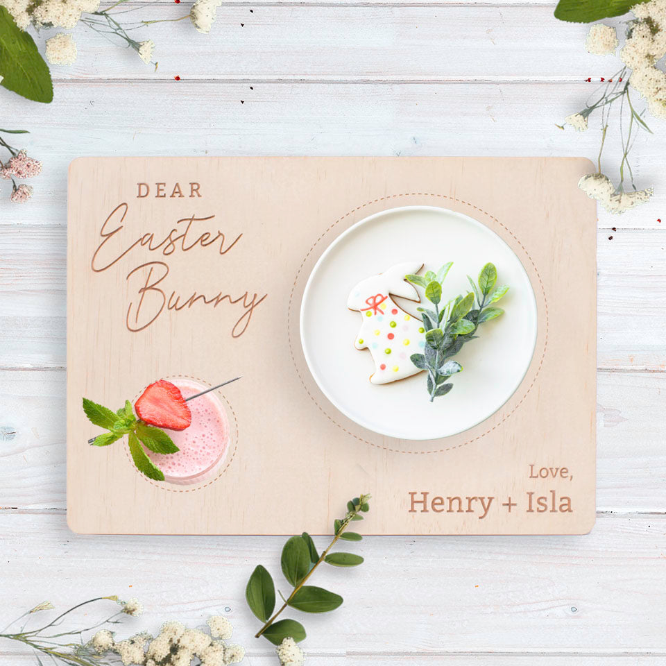 Hello Fern custom timber Easter Bunny snack board with plain design shown on tabletop with cookie, strawberry milkshake, and guide lines for snacks and drinks..