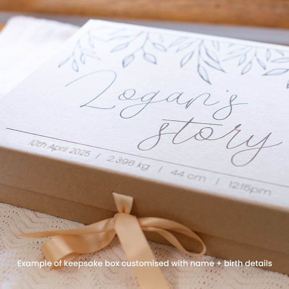 Closeup view example of optional extra kraft keepsake box which can store Hello Fern's wooden baby memory book.