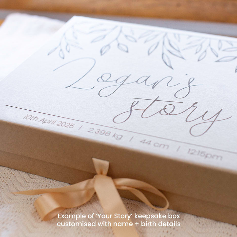 Closeup example of optional extra kraft keepsake box in 'Your Story' design customised with baby's name and birth details, which can store Hello Fern's wooden baby memory book.