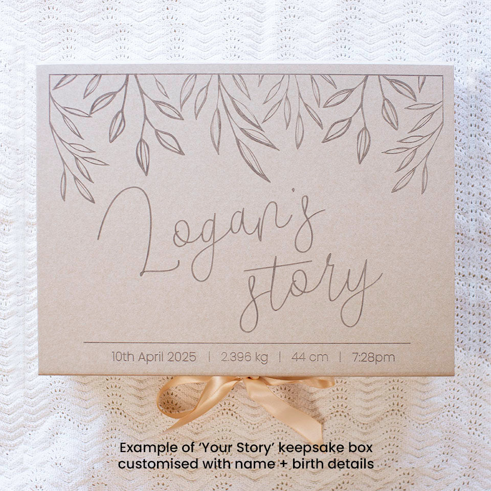 Top view example of optional extra kraft keepsake box in 'Your Story' design with baby's name and birth details, which can store Hello Fern's wooden baby memory book.