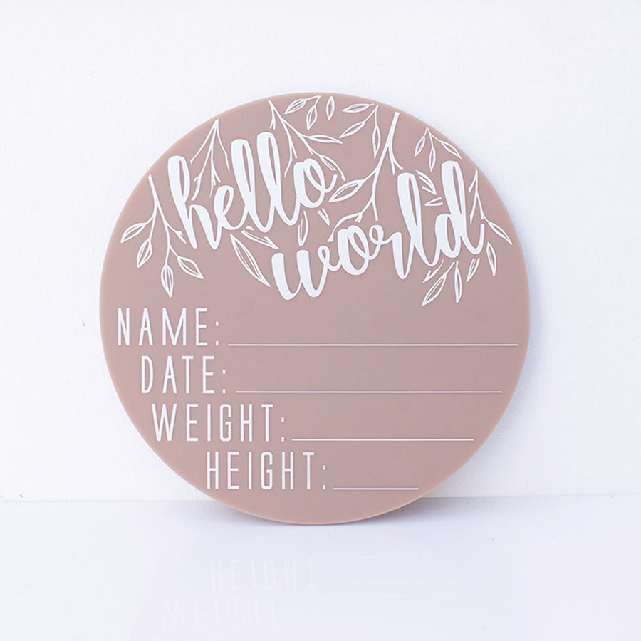 Hello Fern latte acrylic 'Hello Word' birth announcement plaque with spaces for baby's name, birth date, weight, and height isolated on white background.