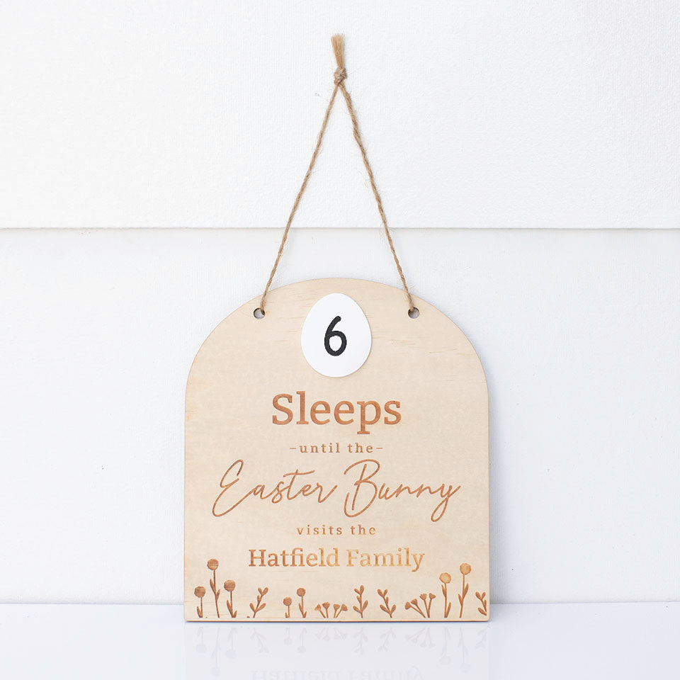 Hello Fern custom Easter countdown sign isolated on white wall with twine for hanging showing nine sleeps until the Easter bunny visits.