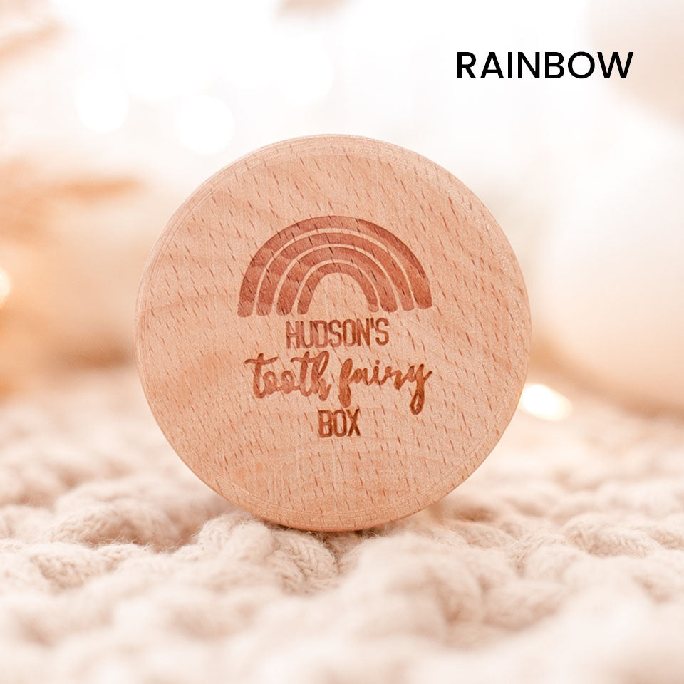 Closeup of Hello Fern tooth fairy wooden trinket box in rainbow style, customised with child's name laser-engraved on lid.