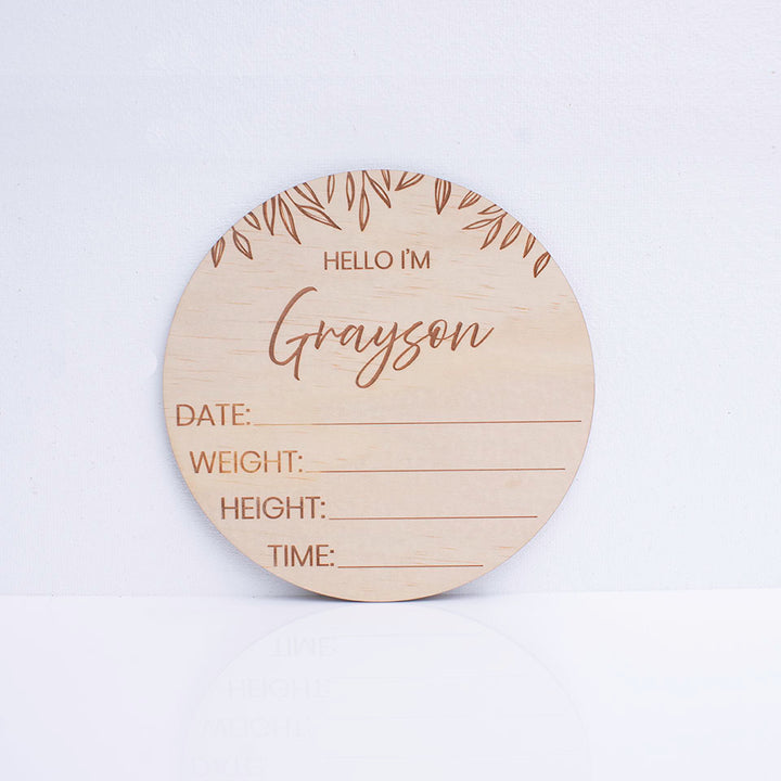 Hello Fern wooden birth announcement disc customised with baby's first name and the words "HELLO I'M" including spaces for birth details.