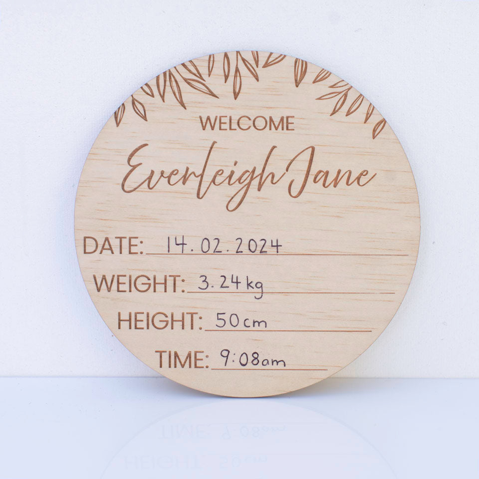 Hello Fern wooden birth announcement disc customised with baby's first and middle names and displaying written birth details.