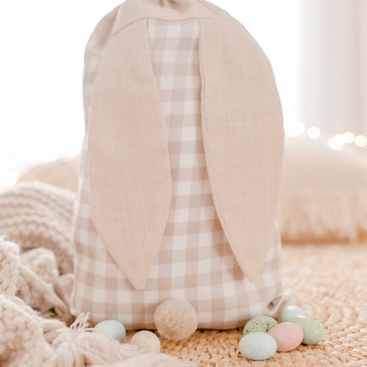 Hello Fern beige gingham Easter Sack showing bunny ears and tail with Easter eggs.