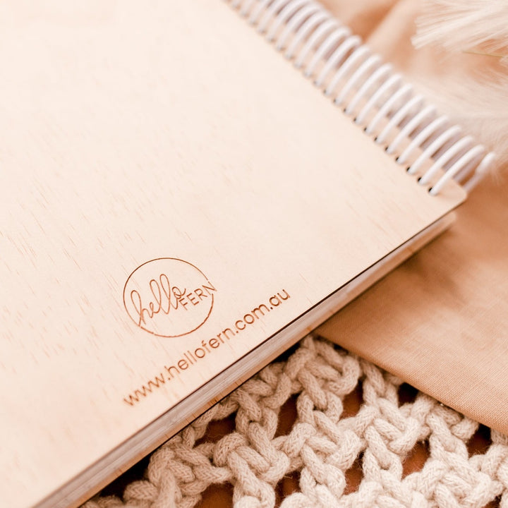 Closeup view of back cover of Hello Fern wooden photo album.